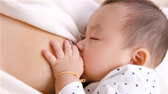 image of baby breast feeding