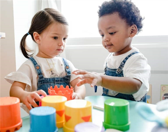 Little children playing with blocks